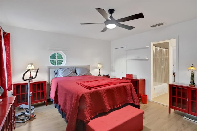 bedroom with ceiling fan, light hardwood / wood-style flooring, and ensuite bathroom