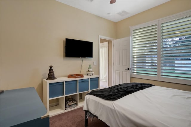 carpeted bedroom with ceiling fan