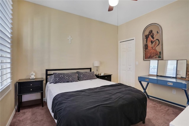 carpeted bedroom featuring a closet and ceiling fan