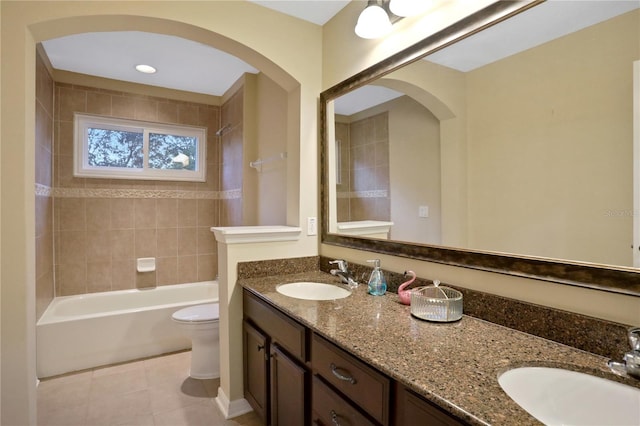 bathroom with vanity, toilet, and tile patterned floors