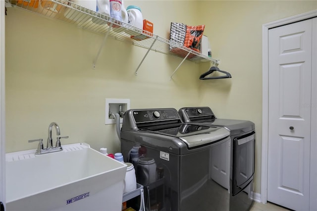 laundry room with sink and washing machine and clothes dryer