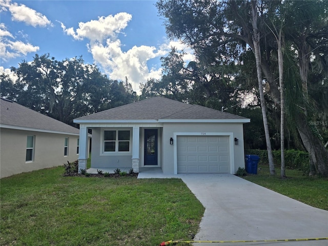 view of front facade featuring a garage and a front yard