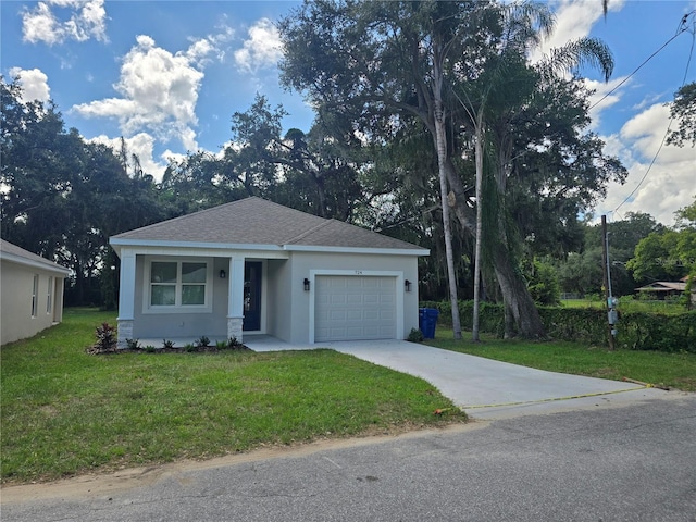 single story home featuring a front lawn and a garage