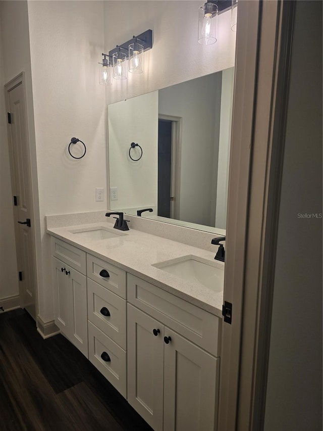 bathroom with vanity and hardwood / wood-style floors