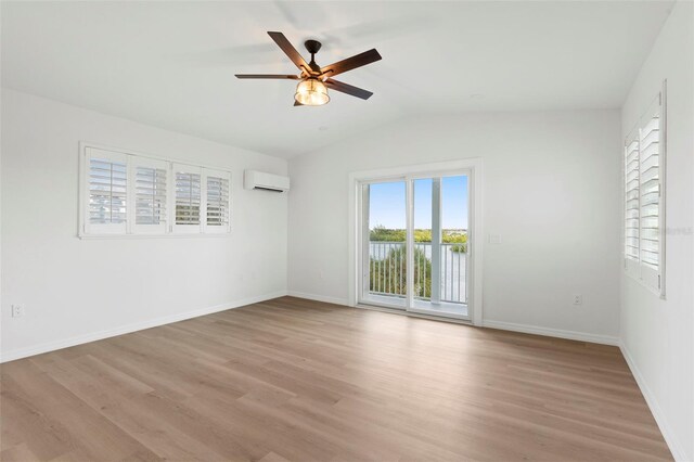 unfurnished room with a healthy amount of sunlight, ceiling fan, and light hardwood / wood-style flooring