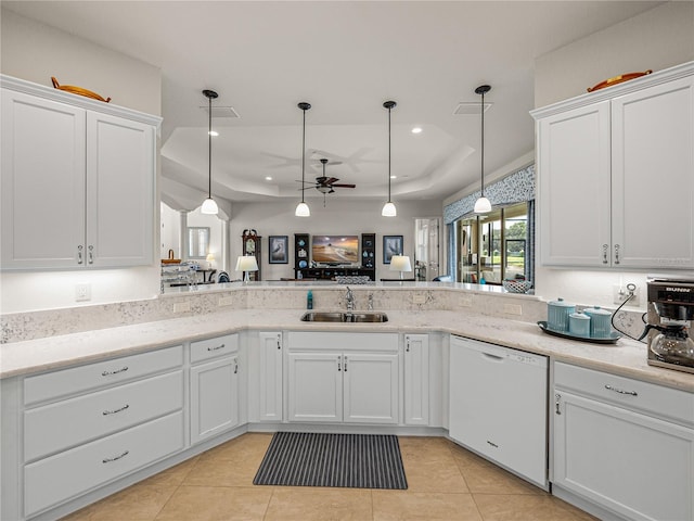 kitchen featuring ceiling fan, white dishwasher, sink, and kitchen peninsula