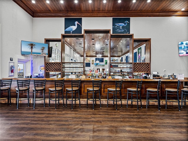 bar featuring wood ceiling and hardwood / wood-style floors