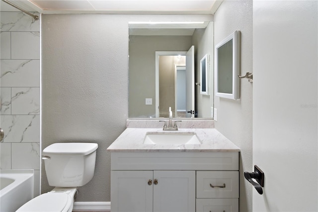 full bathroom with vanity, toilet, and tiled shower / bath