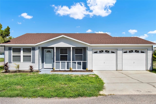 single story home featuring a garage and a front yard