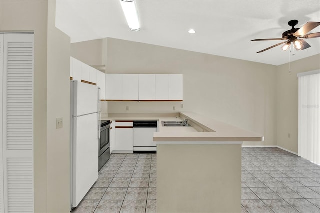 kitchen featuring white cabinets, lofted ceiling, kitchen peninsula, white appliances, and ceiling fan