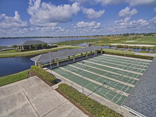 birds eye view of property with a water view