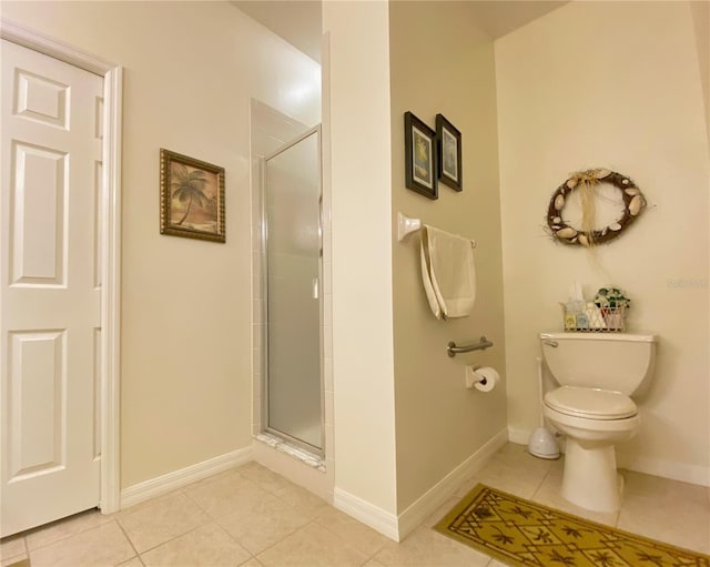 bathroom with toilet, an enclosed shower, and tile patterned flooring