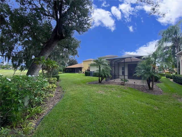 view of yard featuring a lanai