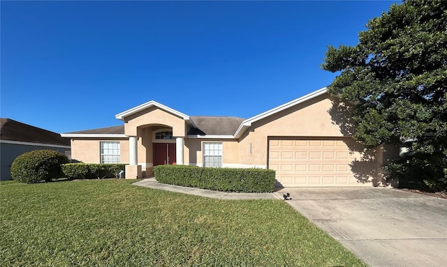 ranch-style home with a garage and a front yard