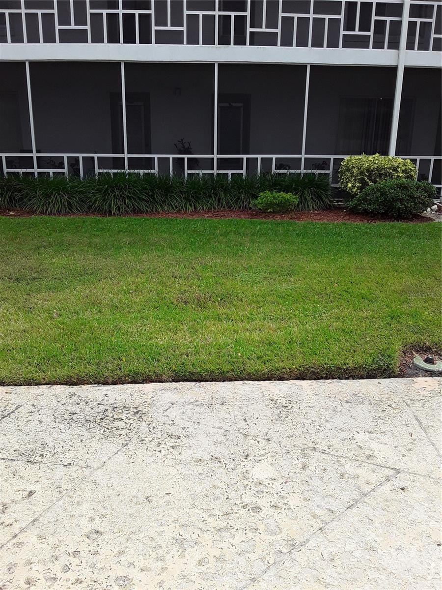 view of yard with a sunroom