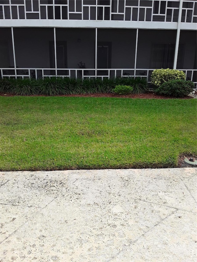 view of yard with a sunroom