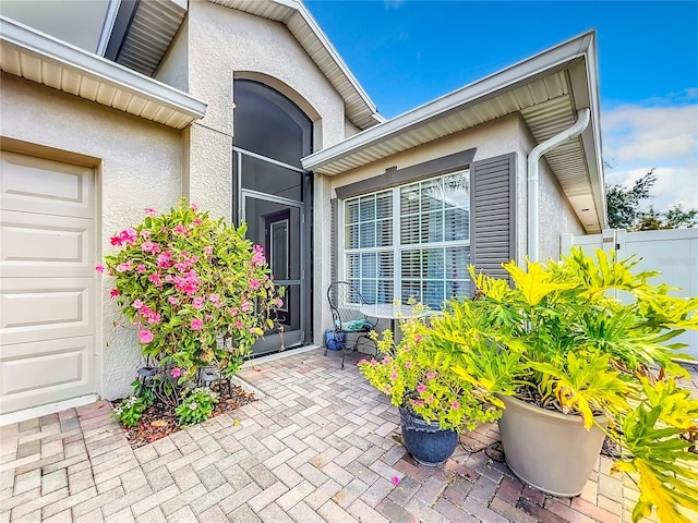 doorway to property featuring a patio area