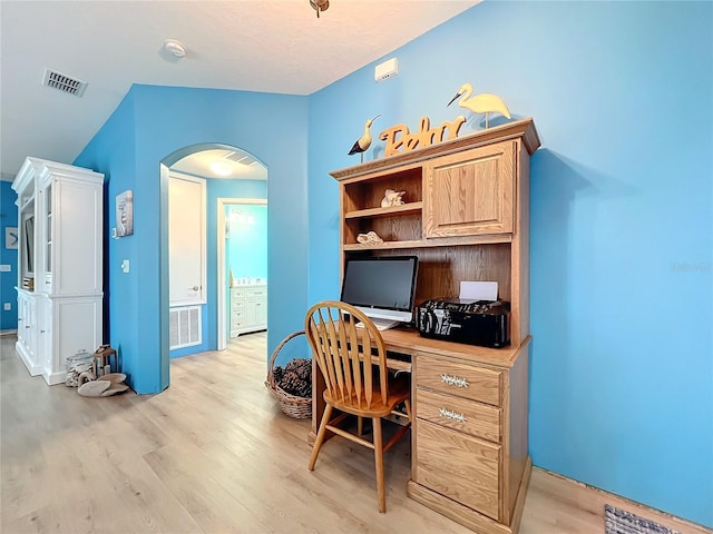 office area featuring light hardwood / wood-style flooring and built in desk