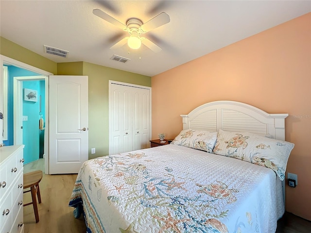 carpeted bedroom featuring ceiling fan and a closet