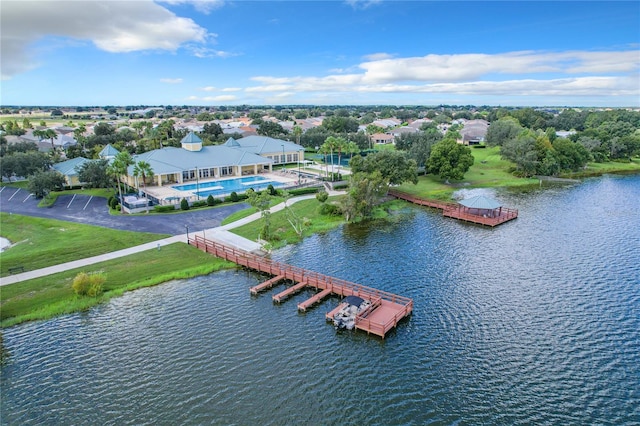 birds eye view of property with a water view