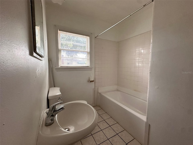 121 Bates Ave SE, Winter Haven, FL 33880 - full bathroom with tile patterned flooring, sink, tiled shower / bath, and toilet