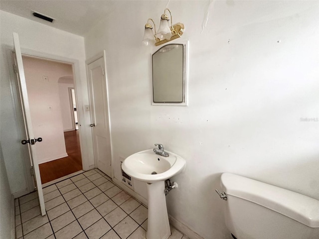 121 Bates Ave SE, Winter Haven, FL 33880 - bathroom featuring toilet and tile patterned floors