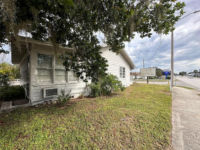 121 Bates Ave SE, Winter Haven, FL 33880 - view of property exterior with a yard