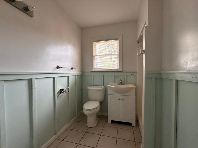 121 Bates Ave SE, Winter Haven, FL 33880 - bathroom with vanity, tile patterned flooring, and toilet