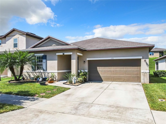 view of front of house with a garage and a front yard