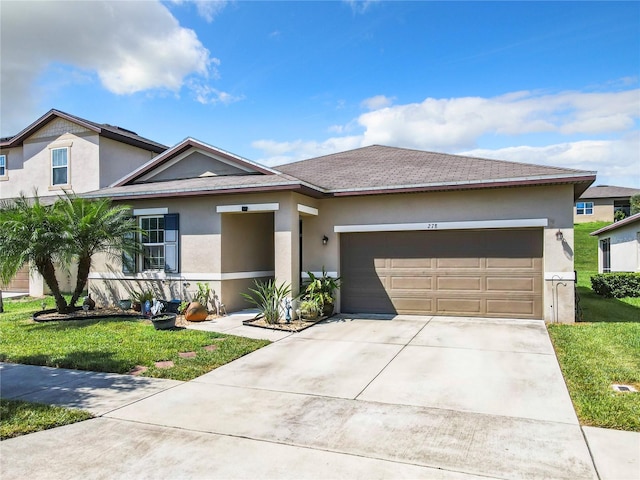 278 Alford Dr, Davenport, FL 33896 - view of front facade with stucco siding, an attached garage, and concrete driveway