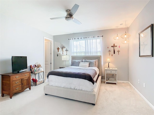 bedroom featuring ceiling fan and light colored carpet