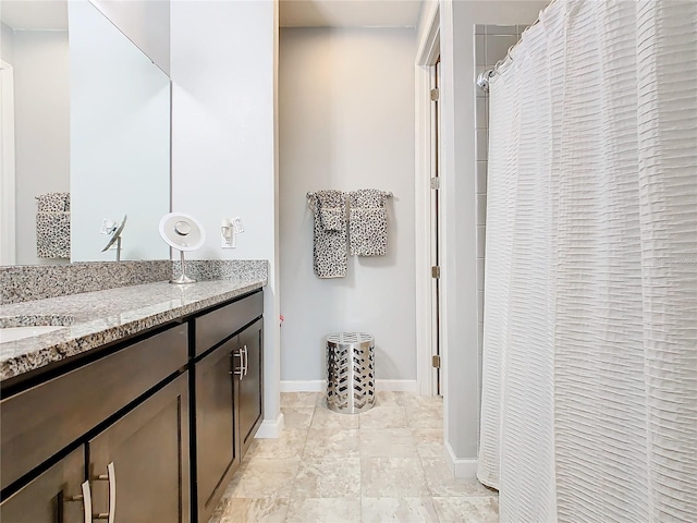 bathroom featuring vanity and a shower with shower curtain