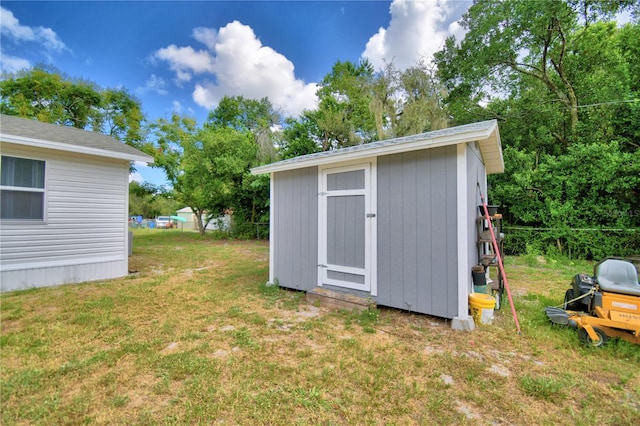 view of outdoor structure with a yard