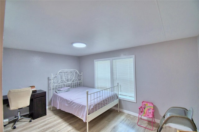 bedroom featuring hardwood / wood-style flooring