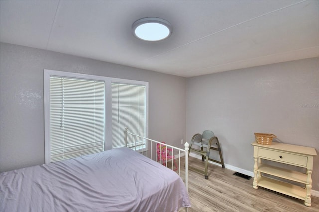 bedroom featuring wood-type flooring