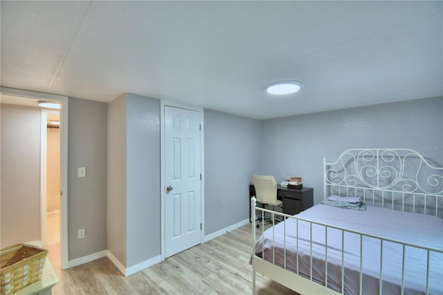 bedroom with light hardwood / wood-style flooring