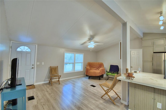 sitting room featuring ceiling fan, vaulted ceiling, and light hardwood / wood-style floors