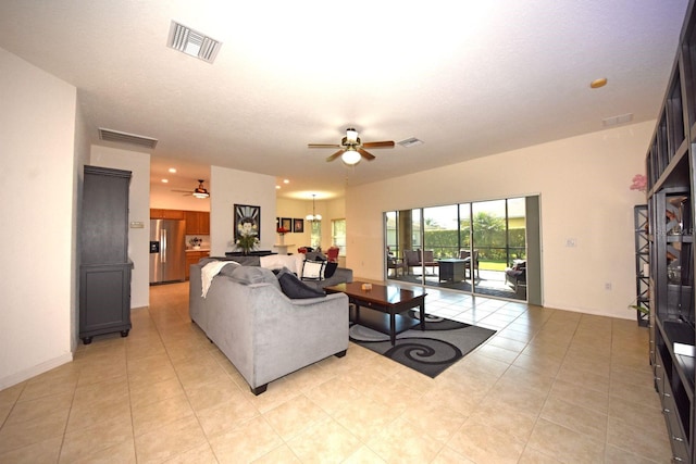 living room featuring ceiling fan and light tile patterned flooring