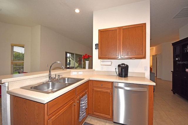 kitchen with kitchen peninsula, sink, light tile patterned floors, and stainless steel dishwasher