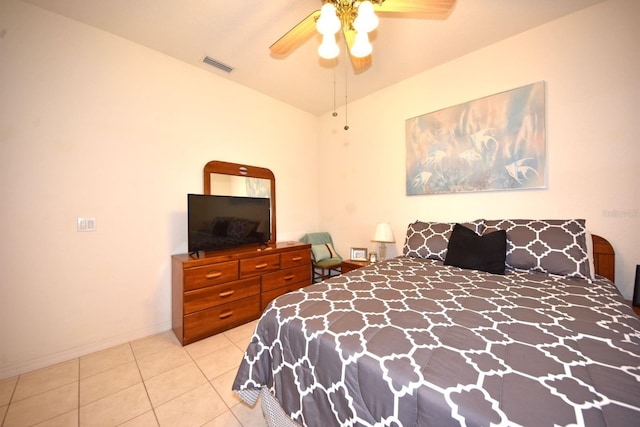 bedroom with ceiling fan and light tile patterned floors