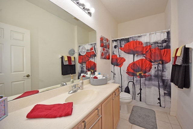 bathroom featuring tile patterned floors, walk in shower, vanity, and toilet