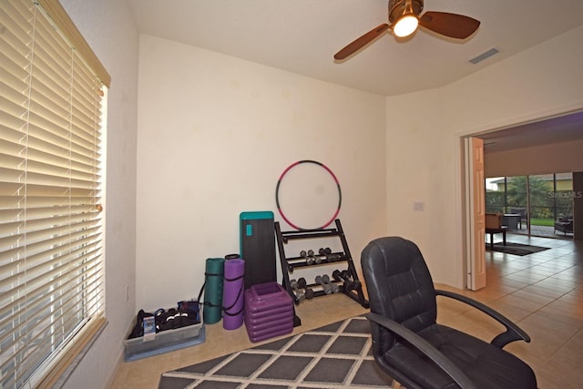 office space featuring ceiling fan and tile patterned flooring