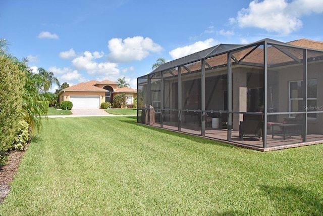 view of yard with a lanai and a garage