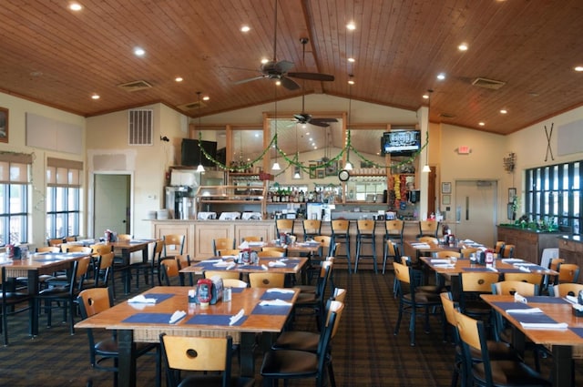 dining space with wood ceiling, ceiling fan, and high vaulted ceiling