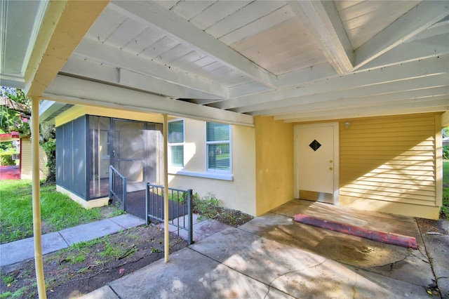 entrance to property featuring a patio area