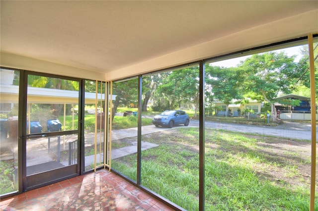 unfurnished sunroom featuring a healthy amount of sunlight