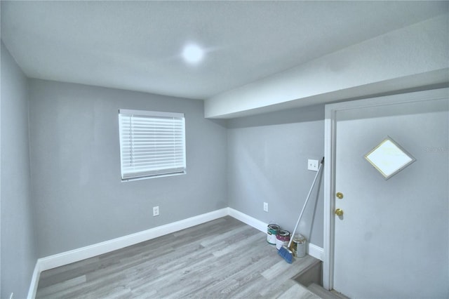 basement featuring hardwood / wood-style flooring