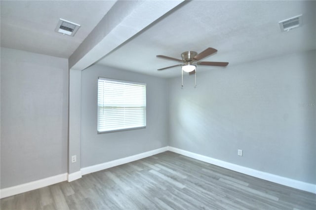 unfurnished room featuring ceiling fan and dark wood-type flooring