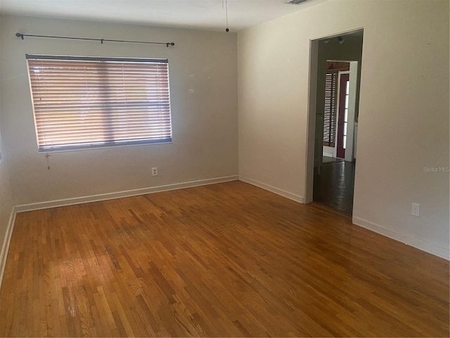 empty room featuring hardwood / wood-style flooring