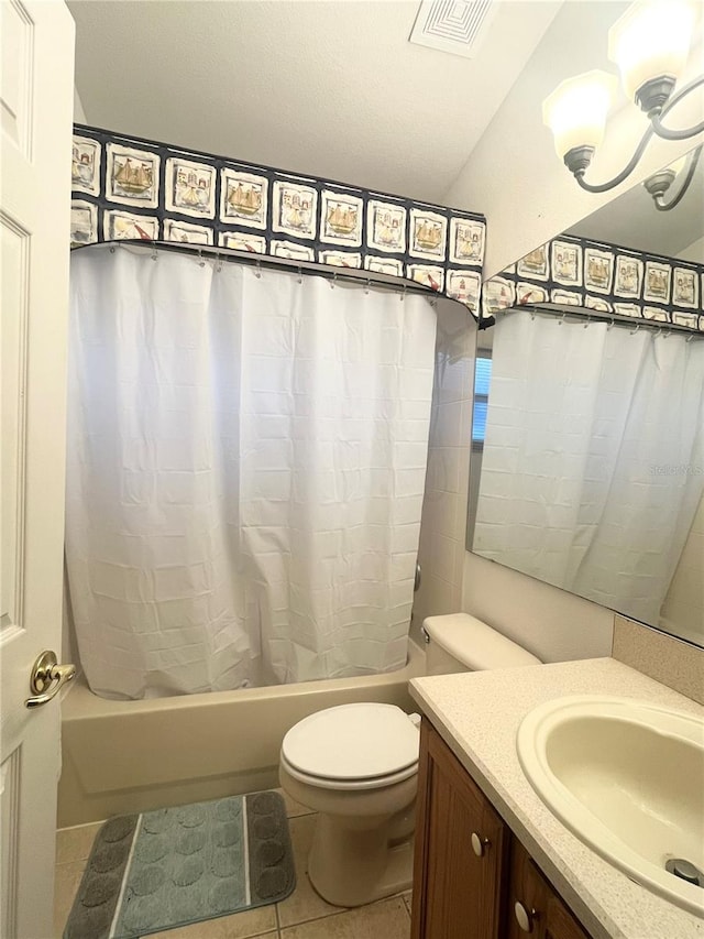 full bathroom featuring vanity, shower / tub combo with curtain, tile patterned flooring, and toilet